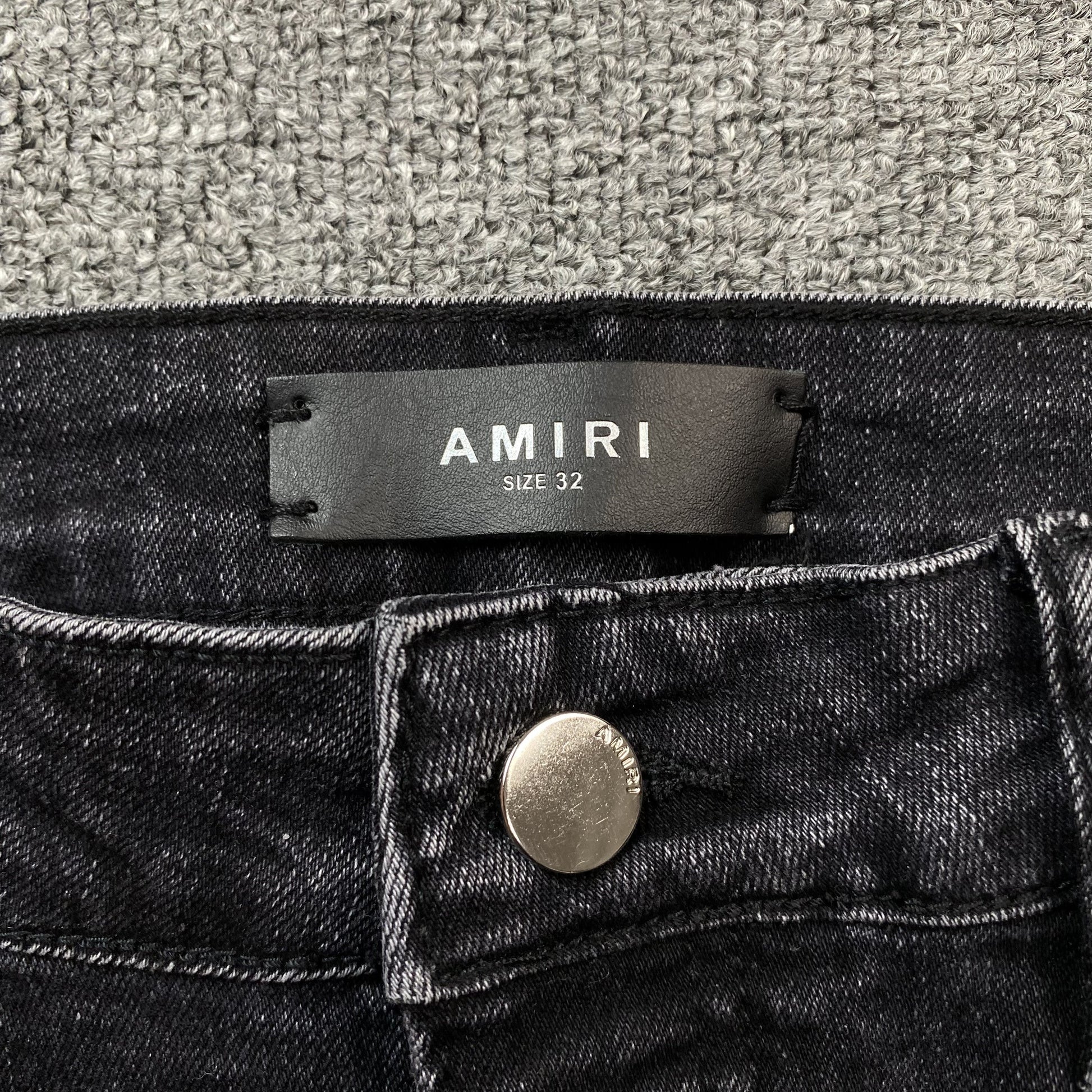 AMIRI VARSITY LOGO REPAIR JEANS