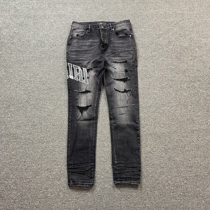 AMIRI VARSITY LOGO REPAIR JEANS